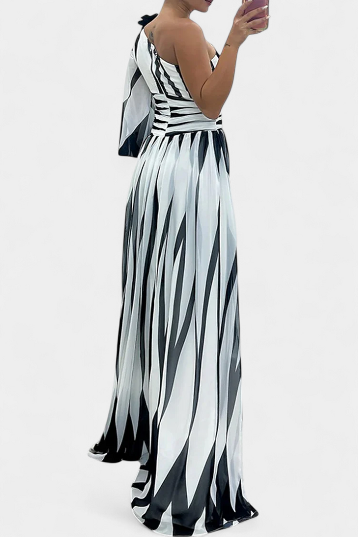 Emma & Rose Cape Town Aubryzah maxi dress for wedding guests, elegant white sophisticated gown with flowing fabric.