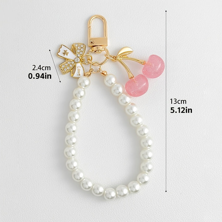 Emma & Rose Cape Town Cherrish Luxe Pearl Cherry accessory with white pearls and gold accents, elegant and stylish.