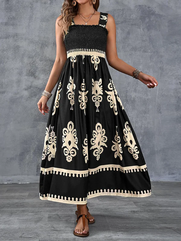 White Emma & Rose Cape Town Martina maxi dress with an artistic print, flowing fabric and elegant design.