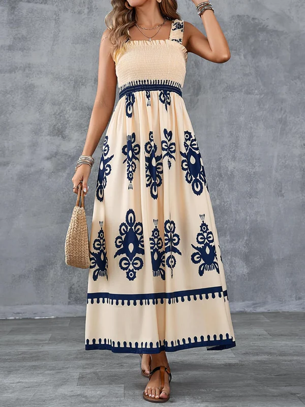 White Martina maxi dress with artistic print by Emma & Rose Cape Town, featuring flowing fabric and vibrant design details.