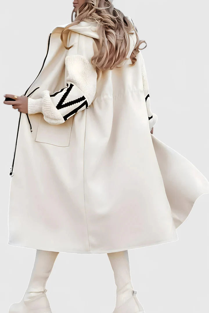 White Vaye™ elegant hooded coat by Emma & Rose Cape Town, showcasing a stylish, lightweight outerwear design with a hood.