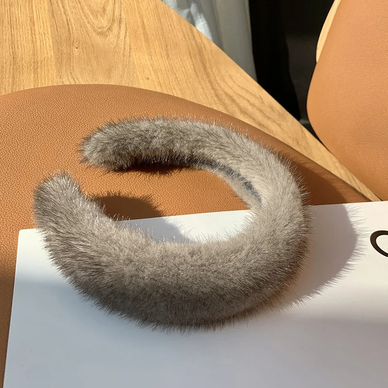 Black Monarque faux fur headband for women, stylish accessory by Emma & Rose Cape Town, showcasing soft plush fur and elegant design.
