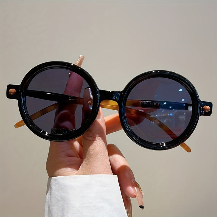Emma & Rose Cape Town Celeste vintage circular frames for women, obsidian black fashion accessory with round design.