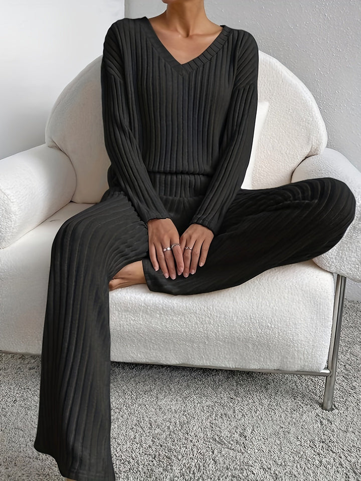 Black women's Chill Knit Lounge Set from Emma & Rose Cape Town, featuring a comfortable relaxed fit and cozy knit fabric.