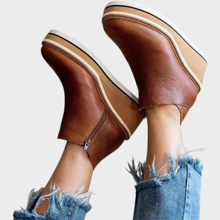 Emma & Rose Cape Town Vina™ Pu Leather Ankle Boots, stylish black ankle Zapato with sleek design and side zipper details.