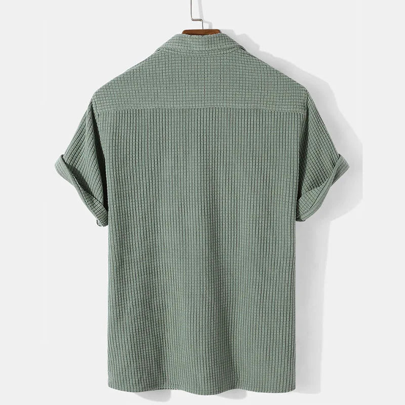 Khaki men's casual summer shirt from Emma & Rose Manhattan's Andries™ collection, featuring a relaxed fit and breathable fabric.