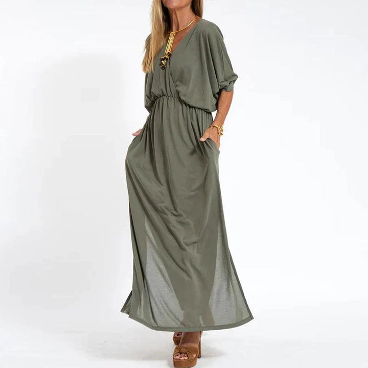 Light gray Emilia™ maxi dress for women by Emma & Rose Manhattan, flowing fabric and elegant design perfect for summer wear.