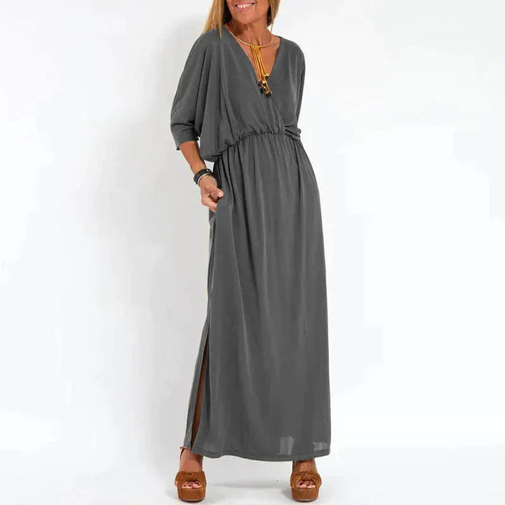 Light gray Emilia™ maxi dress for women by Emma & Rose Manhattan, flowing fabric with a relaxed, elegant fit.