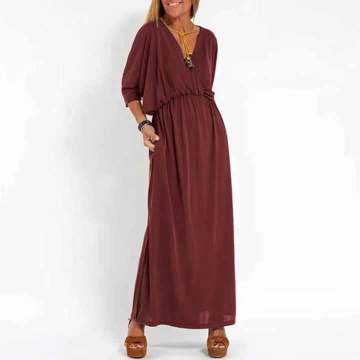 Light gray Emilia maxi dress for women by Emma & Rose Manhattan, flowing fabric and elegant design perfect for casual or formal wear.