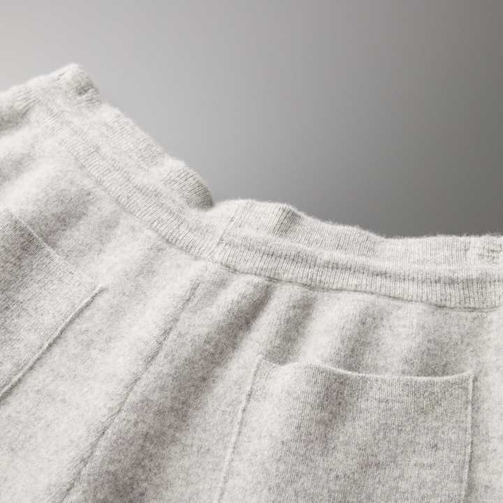 Light gray tailored trousers from Emma & Rose Manhattan's Preston™ collection, showing a close-up of the stylish, slim-fit design.