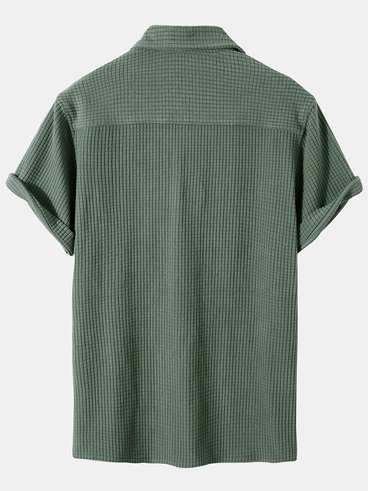 Green Tucker™ short-sleeved two-piece outfit by Emma & Rose Manhattan, featuring a comfortable top and matching shorts.