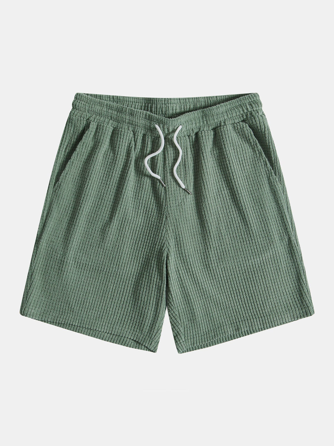 Emma & Rose Manhattan Tucker™ short-sleeved two-piece outfit for women, featuring a stylish green top and matching shorts.