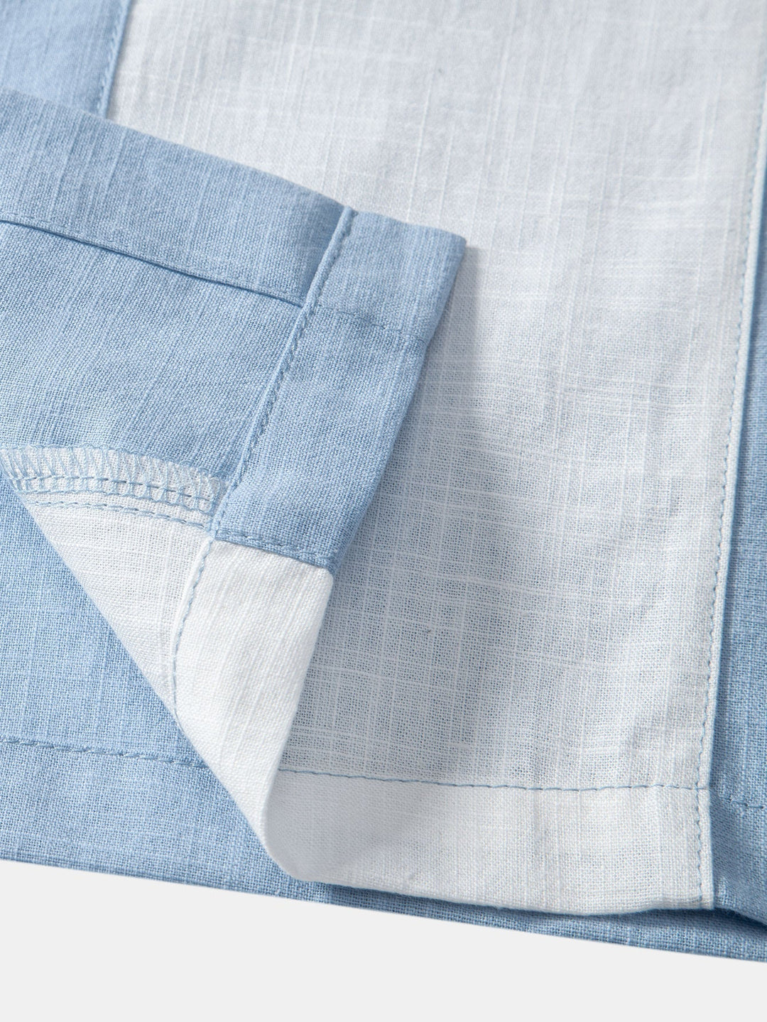 Light blue Torsten™ short-sleeved two-piece outfit by Emma & Rose Manhattan, featuring a stylish top and matching shorts.