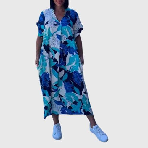 Elegant summer dress by Emma & Rose Cape Town featuring lightweight fabric, floral pattern, and a stylish fit for warm weather.