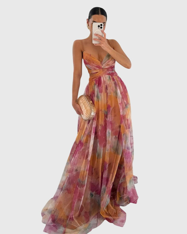 Giselle™ floral maxi dress by Emma & Rose Cape Town, flowing fabric with vibrant floral pattern and elegant design.
