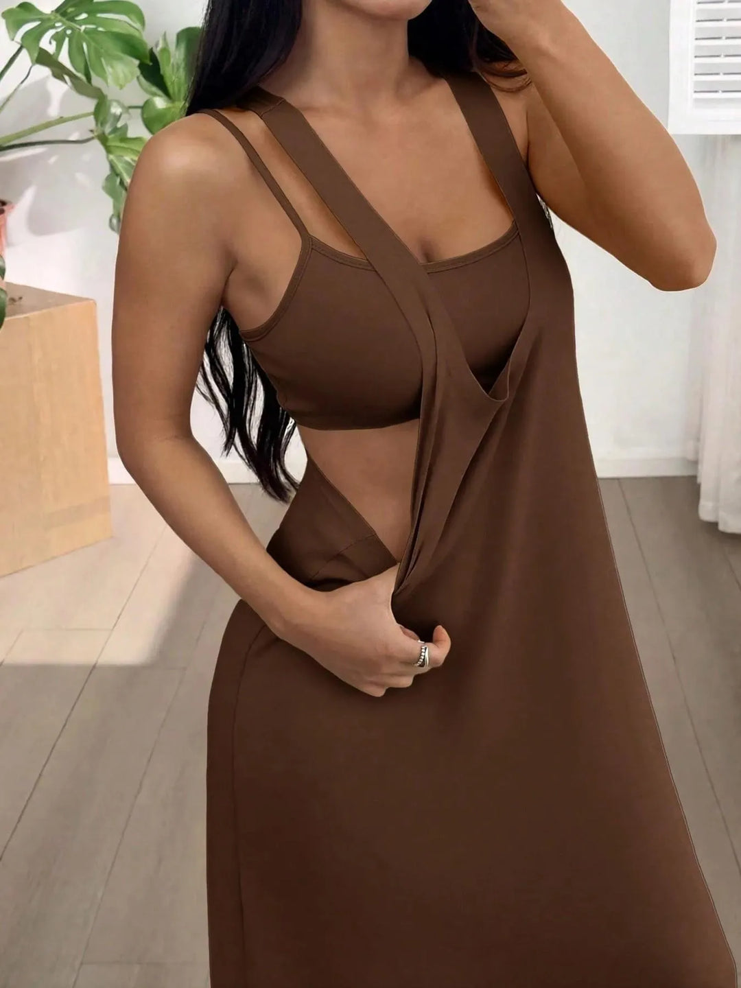 Long women's dress with a two-piece effect and side cutouts