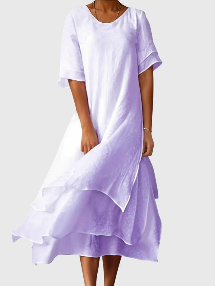 Elegant April™ dress by Emma & Rose Cape Town featuring a flowing fabric and chic design, perfect for stylish occasions.