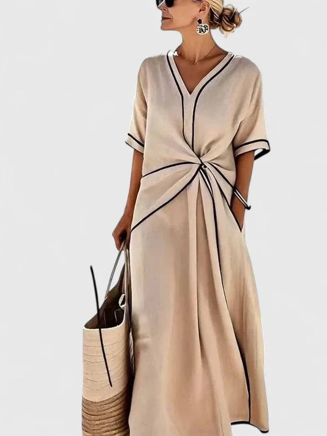 Elegant Erykahhh™ dress by Emma & Rose Cape Town featuring a stylish, flowing design with intricate details and a sophisticated silhouette.