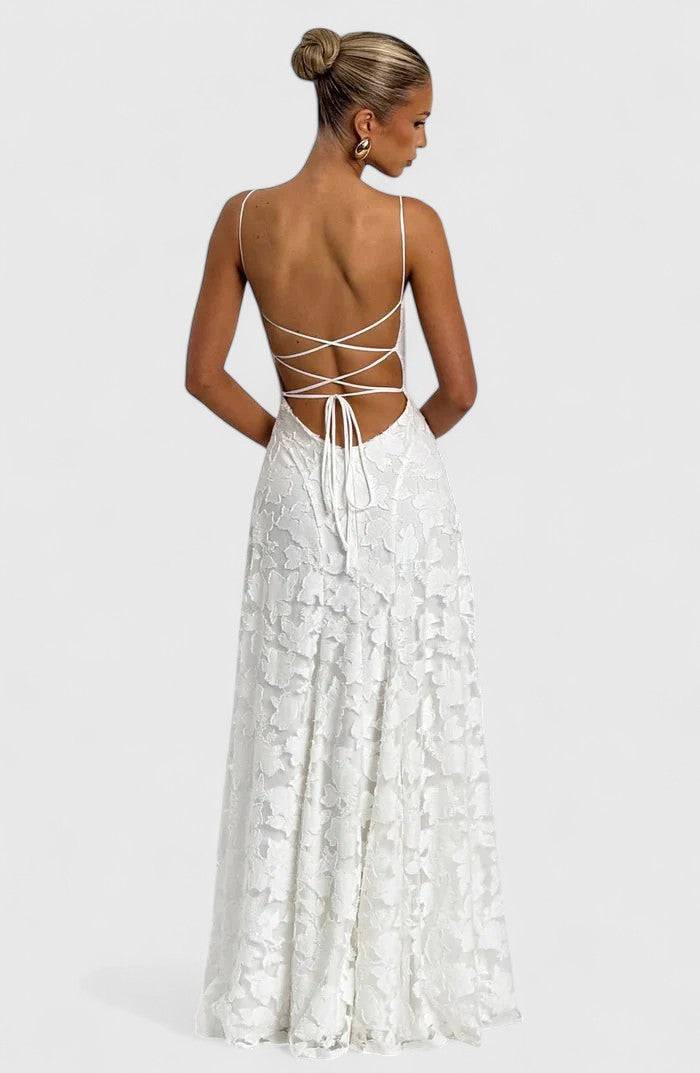 Elegant Gwenn™ Maxi Dress by Emma & Rose Cape Town featuring flowing fabric and a stylish neckline, shown on a model.