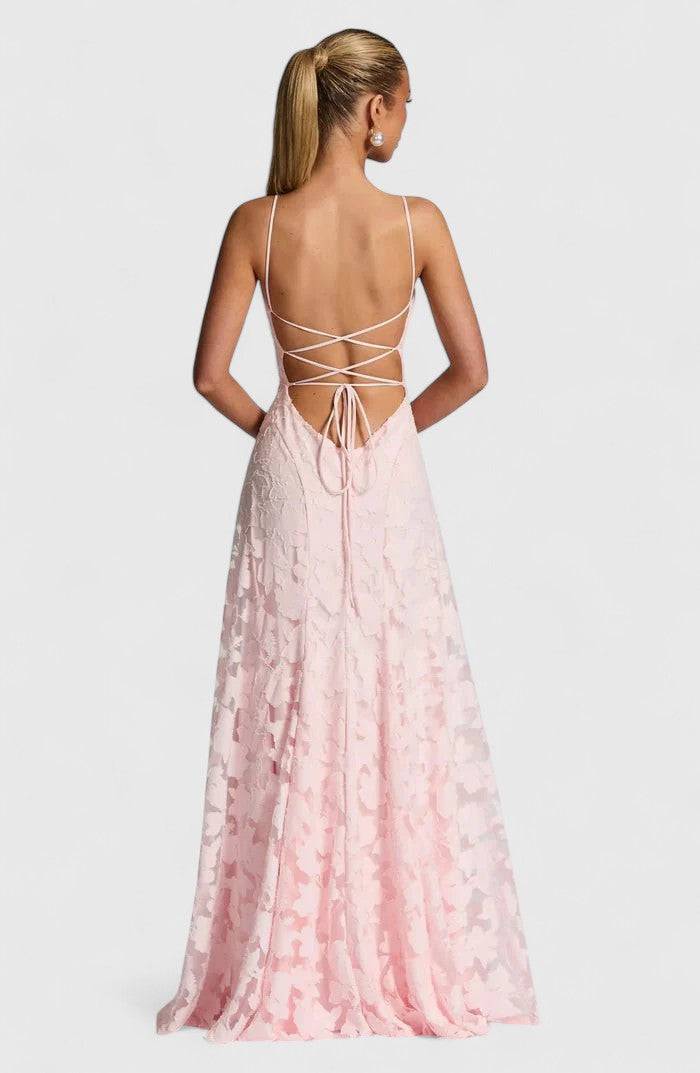 Gwenn™ elegant maxi dress by Emma & Rose Cape Town, flowing fabric, V-neck, and long sleeves, worn by a model outdoors.