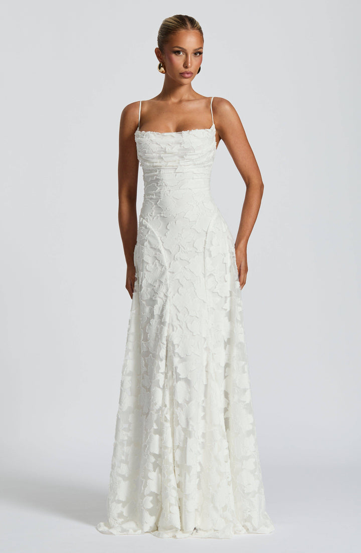 Ivory Maevy™ elegant maxi dress by Emma & Rose Cape Town, flowing fabric with a fitted bodice and full-length skirt.
