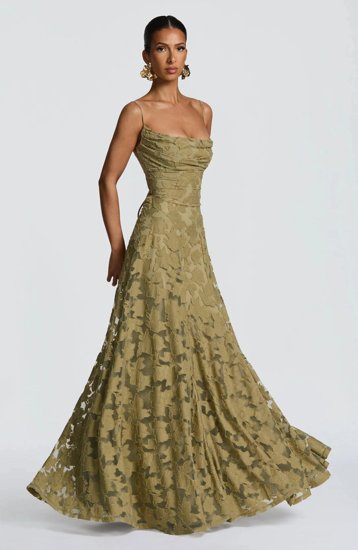 Maevy™ elegant sage maxi dress by Emma & Rose Cape Town, flowing fabric, stylish design, worn by a model outdoors.
