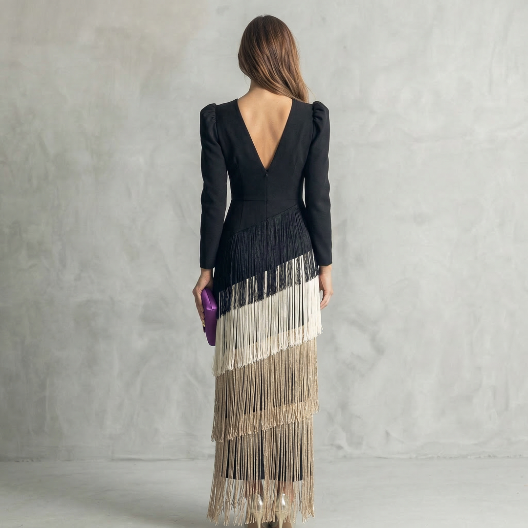 Elegant sage-colored fringe dress by Emma & Rose Cape Town, featuring flowing fringe details and a stylish high-end fashion look.