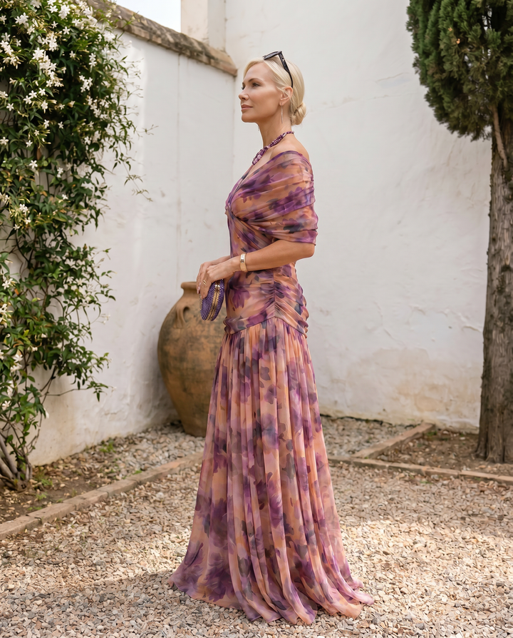 Elegant maxi dress with sweetheart neckline by Emma & Rose Cape Town, featuring flowing fabric and stylish design for parties.