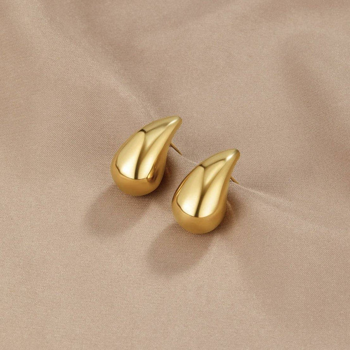Gold teardrop earrings from Luna™ Stiliga Gold Earrings collection by Emma & Rose Cape Town, showcasing elegant jewelry design.
