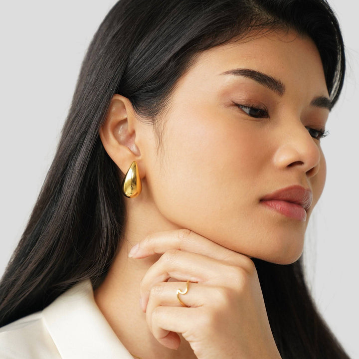 Luna™ Stiliga gold teardrop earrings by Emma & Rose Cape Town featuring elegant, polished gold jewelry with a delicate teardrop design