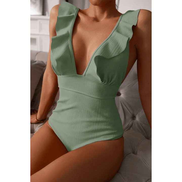Olivia™ Mirage Swimsuit by Emma & Rose Manhattan in gold, featuring a stylish bikini design with sleek straps and vibrant color.
