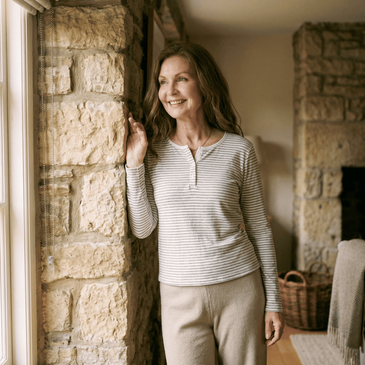 Emma & Rose Manhattan Sienna™ stripe long sleeve top with a fitted design and classic pattern, shown on a model.