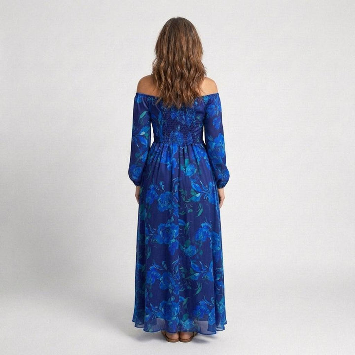 Aspen™ shoulder floral maxi dress by Emma & Rose Cape Town, featuring a flowing fabric with vibrant floral patterns and shoulder details.