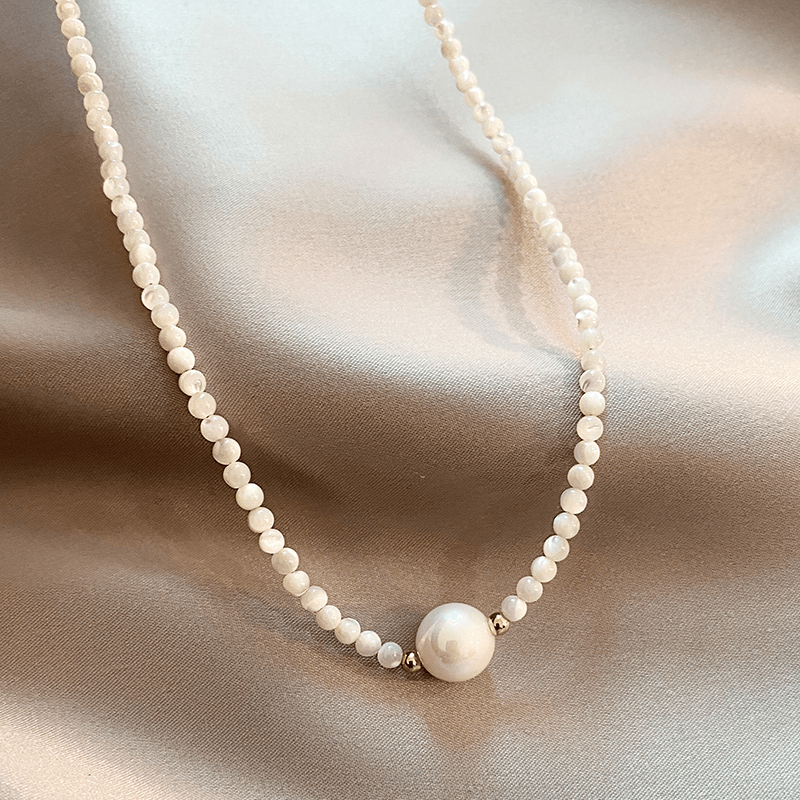 Elegant pearl necklace from Ariel™ by Emma & Rose Cape Town, featuring luminous white pearls and a delicate clasp.