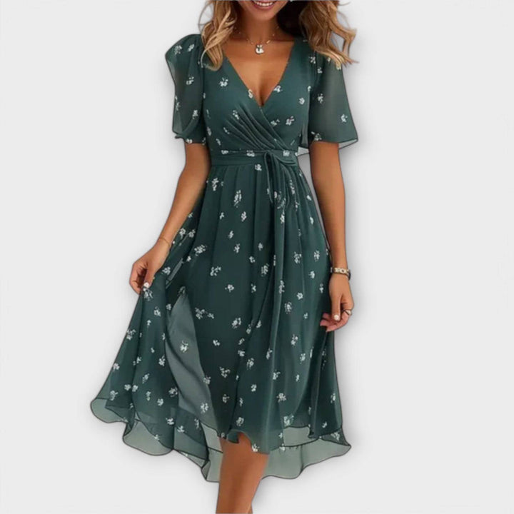 Elegant Clara™ dress by Emma & Rose Cape Town, featuring a stylish design, fitted silhouette, and flowing fabric.
