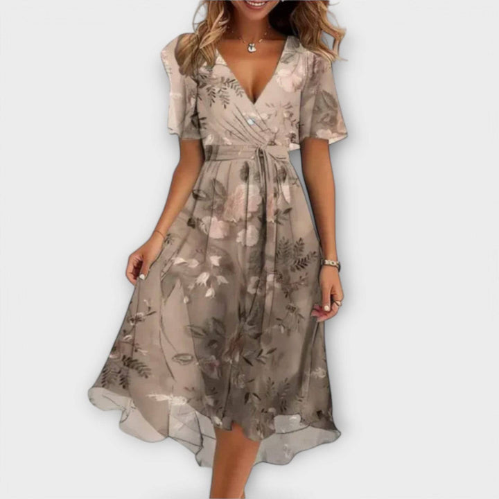 Elegant Clara™ dress by Emma & Rose Cape Town, featuring a stylish design with flowing fabric and intricate details.
