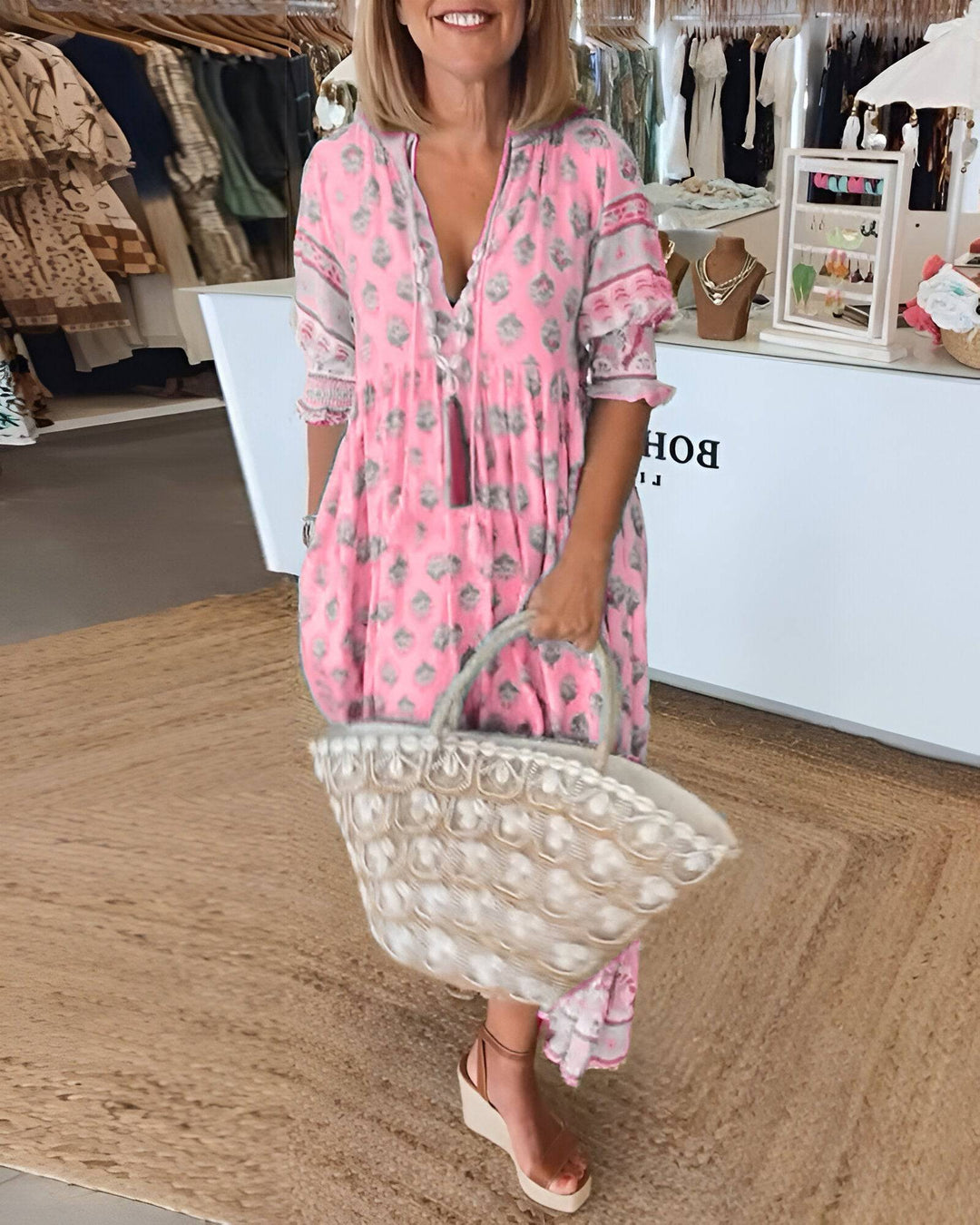 Bérénice™ bright summer dress by Emma & Rose Manhattan, featuring vibrant floral patterns and lightweight fabric.