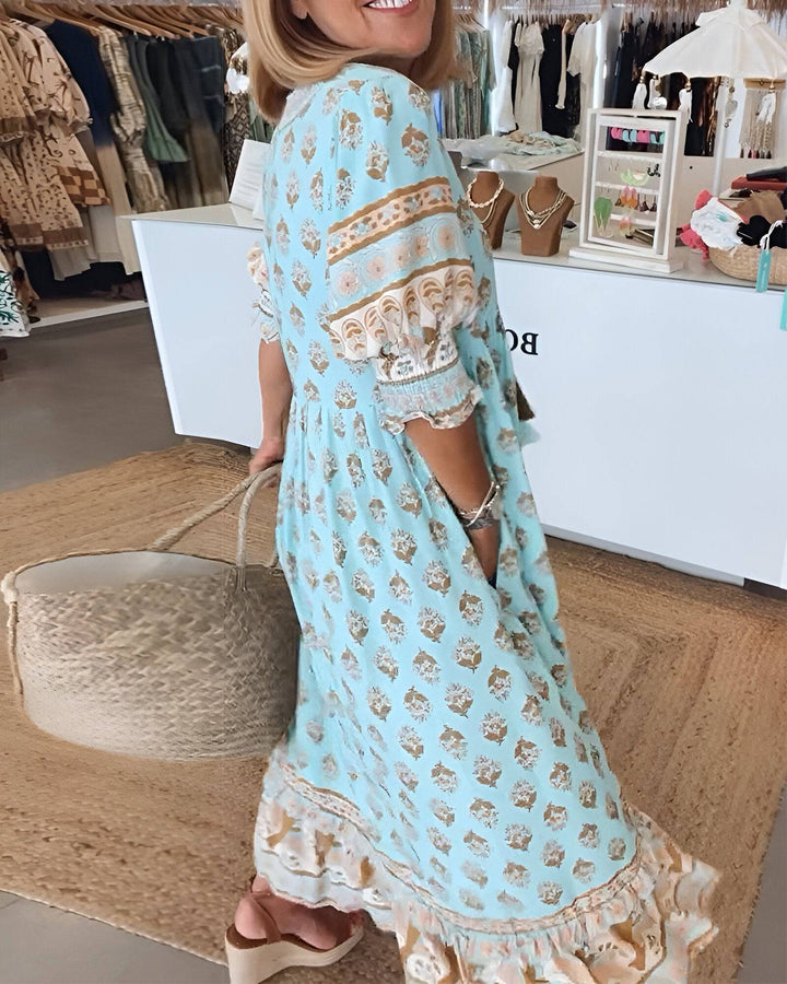 Bright summer dress by Emma & Rose Manhattan featuring vibrant floral patterns and lightweight fabric, perfect for warm weather.