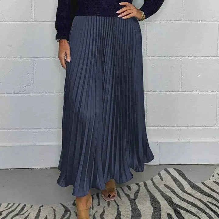 Elegant Maeliq™ maxi dress by Emma & Rose Cape Town featuring flowing fabric and a sophisticated design, shown on a model.