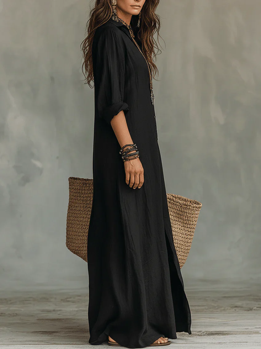 Elegant Emma & Rose Cape Town Willow summer maxi dress shown on a hanger with flowing fabric and floral details.