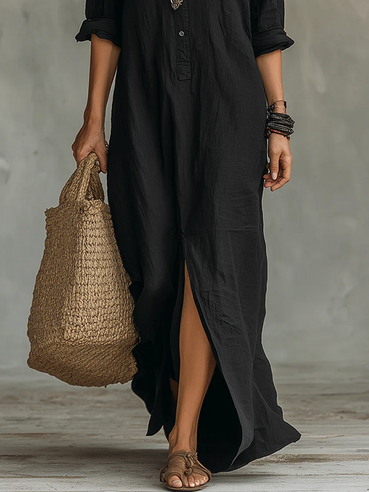 Elegant summer maxi dress from Emma & Rose Cape Town featuring a flowing fabric and intricate floral pattern.