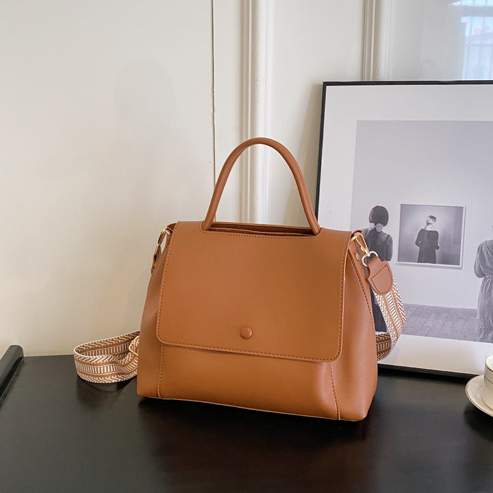 Synthetic leather handbag with structured design in crossbody style - Renata