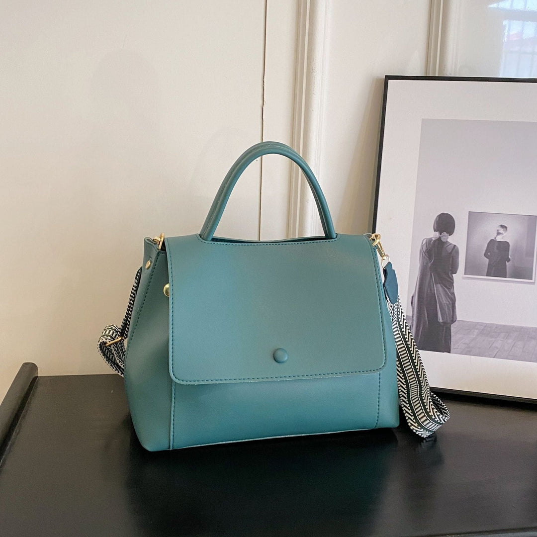 Synthetic leather handbag with structured design in crossbody style - Renata