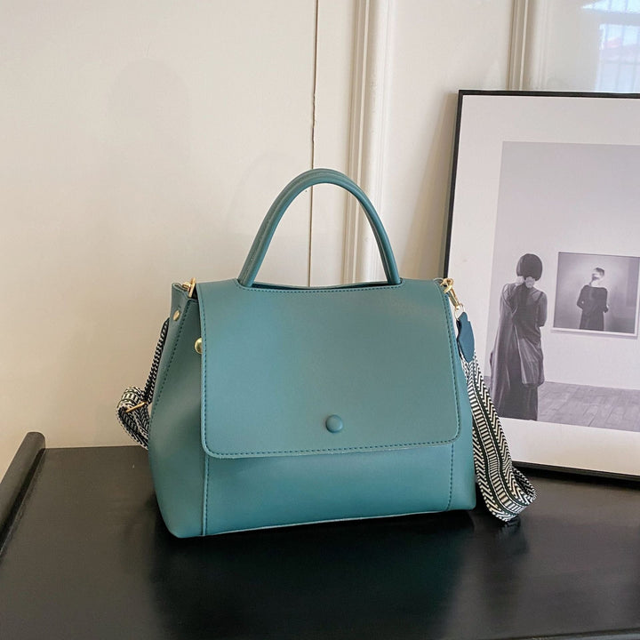 Synthetic leather handbag with structured design in crossbody style - Renata
