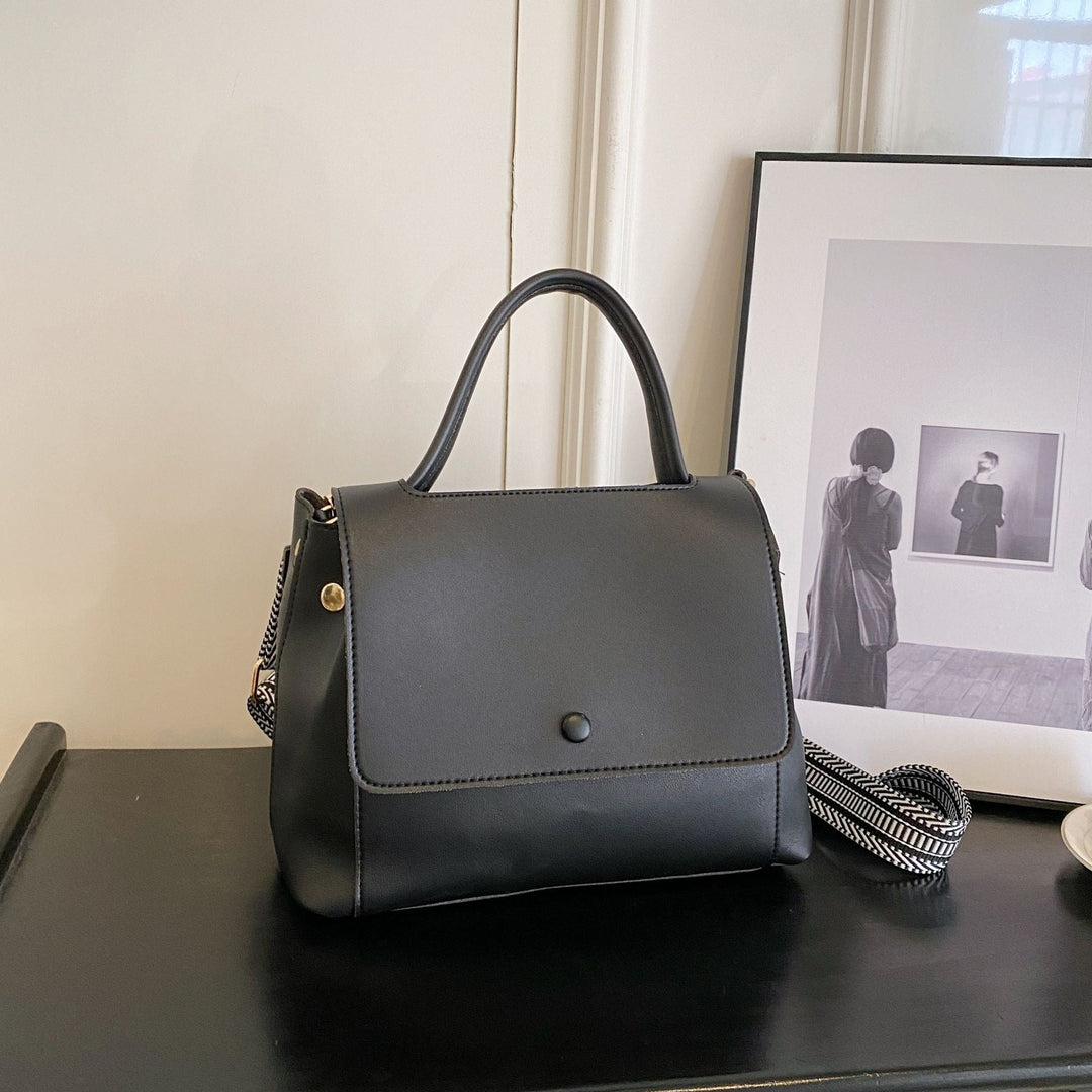 Synthetic leather handbag with structured design in crossbody style - Renata