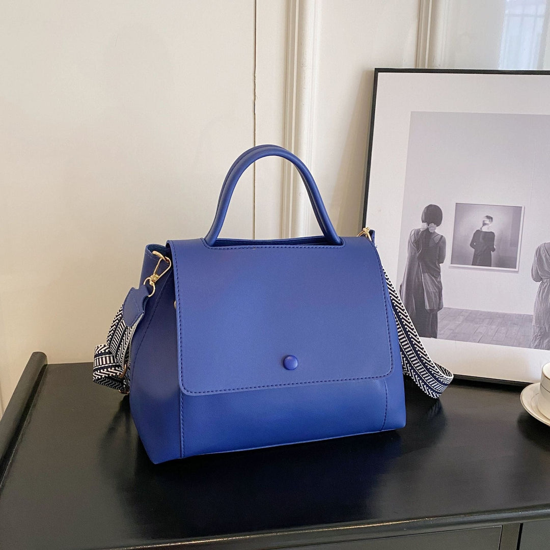 Synthetic leather handbag with structured design in crossbody style - Renata