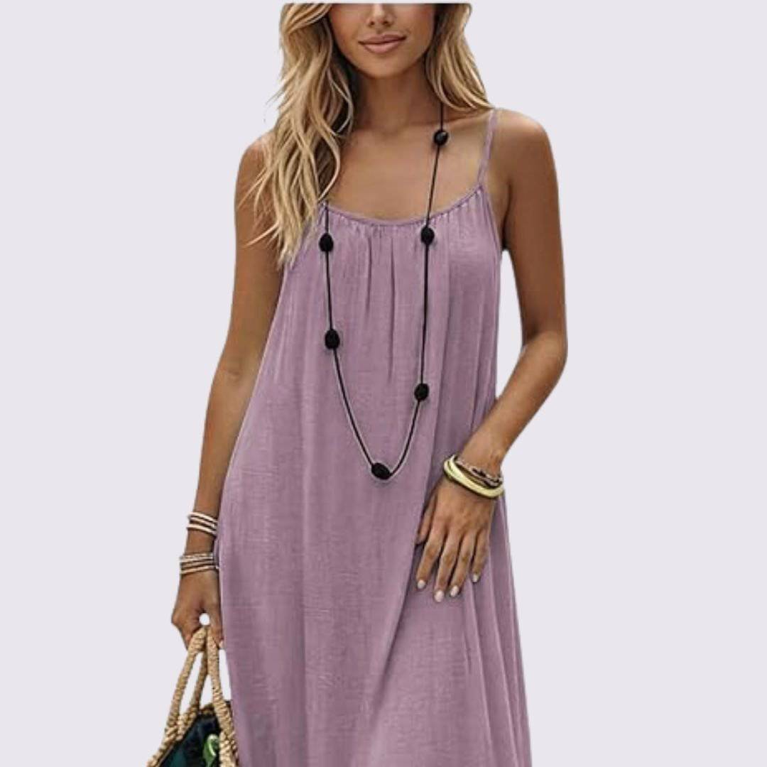 Elegant Emma & Rose Nuance Dress in La Câline fabric, featuring a flowing design and subtle color details.