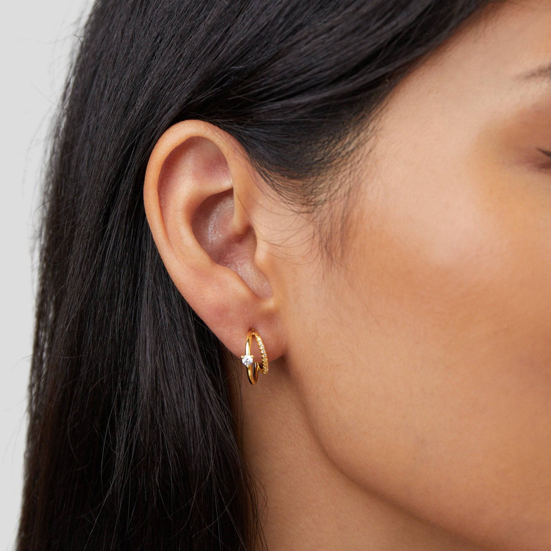 Gold hoop earrings with layered crystal embellishments from Emma & Rose Cape Town's Jenny™ Elegant Crystal Earrings collection.