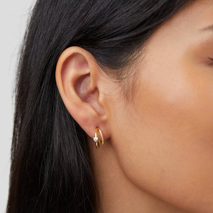 Gold hoop earrings with layered crystal embellishments from Emma & Rose Cape Town's Jenny™ Elegant Crystal Earrings collection.