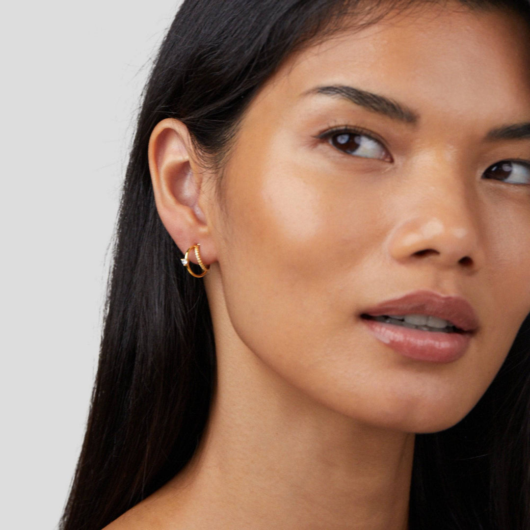 Gold hoop earrings with layered crystal embellishments from Emma & Rose Cape Town's Jenny™ Elegant Crystal Earrings collection.